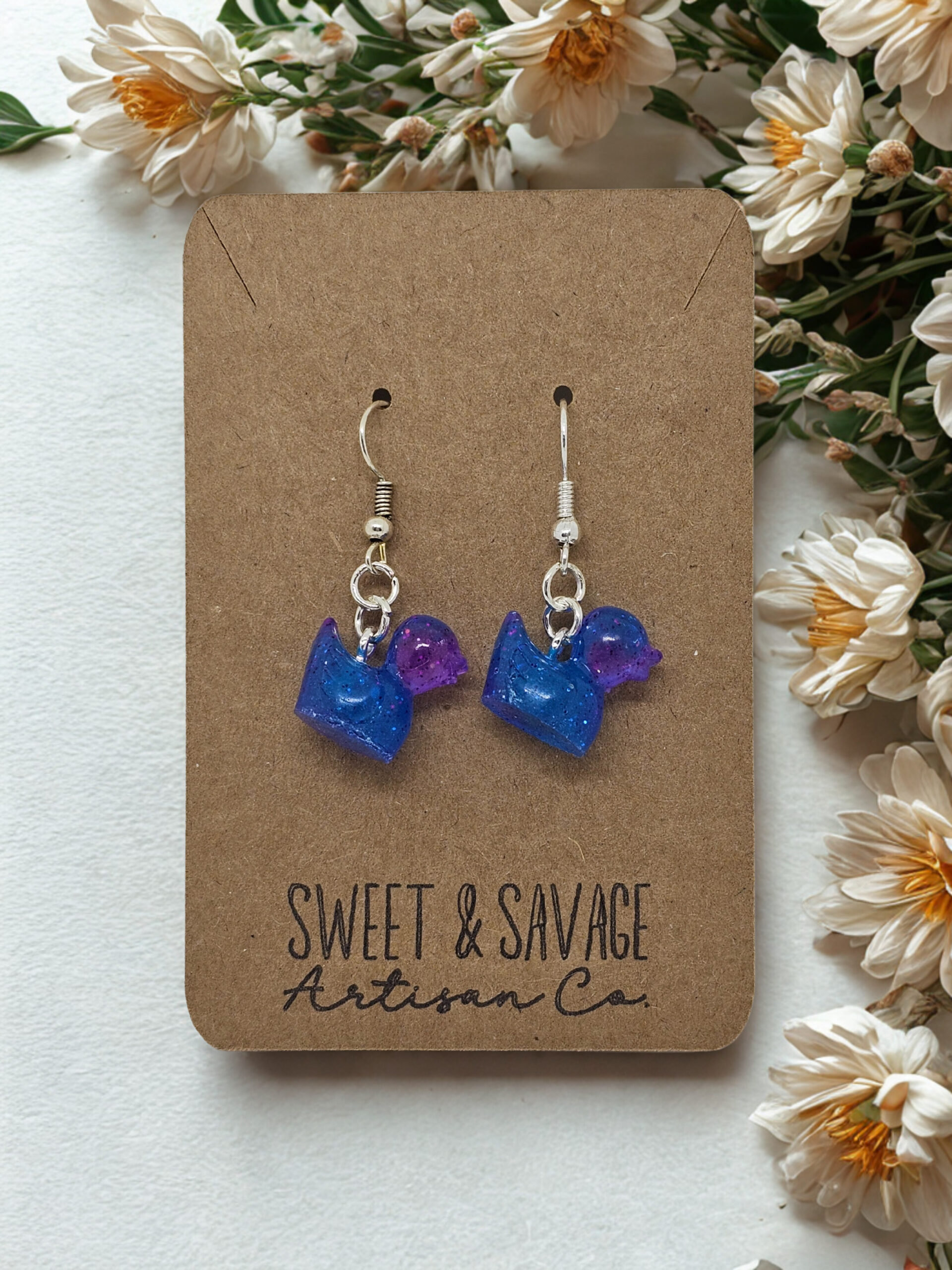 Glow Quackers – Cosmic Blue & Purple Glow-in-the-Dark Duck Earrings