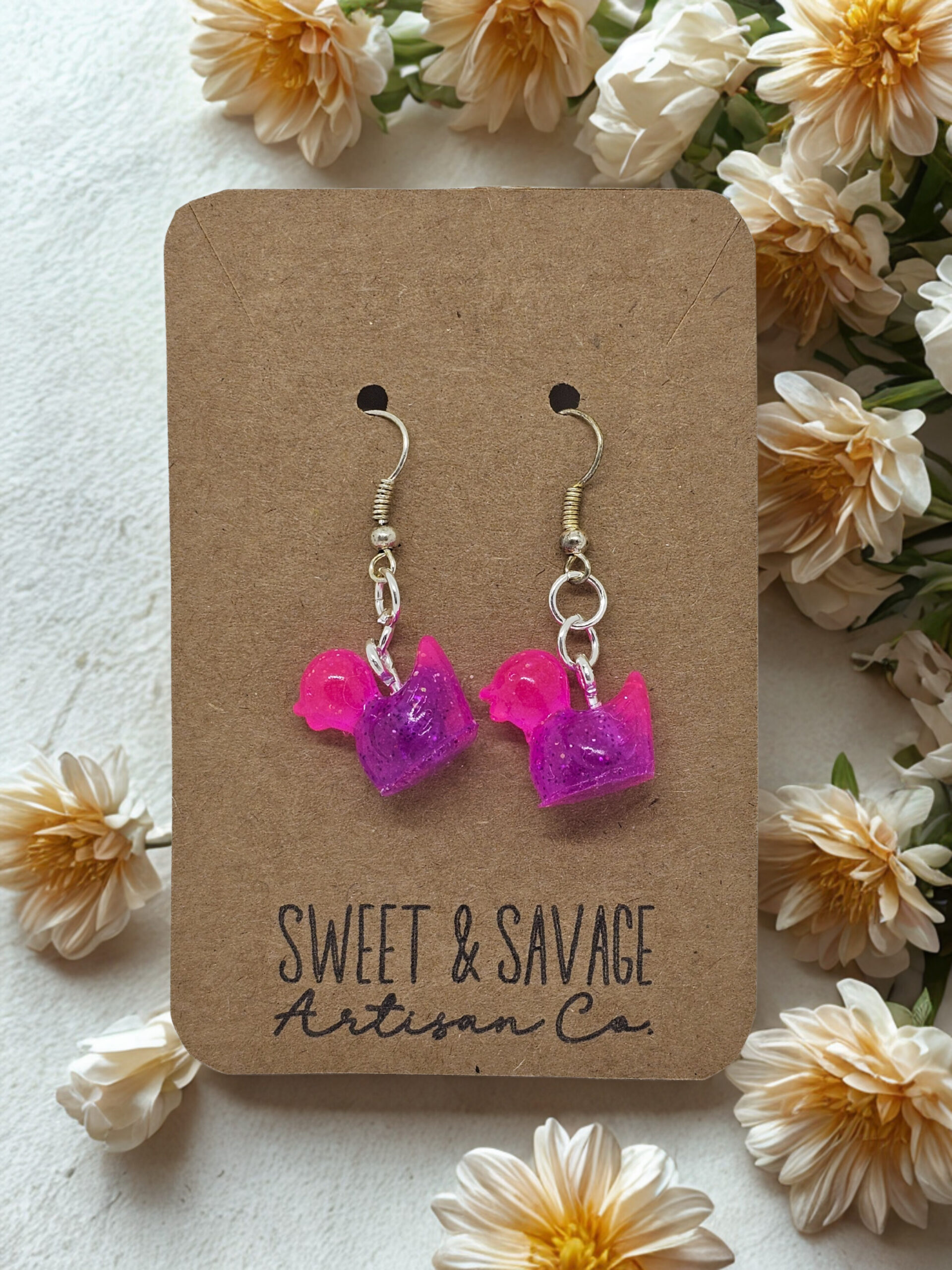 Glow Quackers – Pink & Purple Glow-in-the-Dark Duck Dangle Earrings